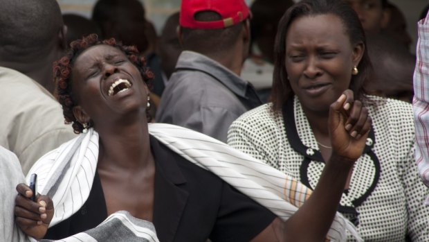 A woman cries after seeing the body of a relative killed in Thursday's attack on a university in Kenya.