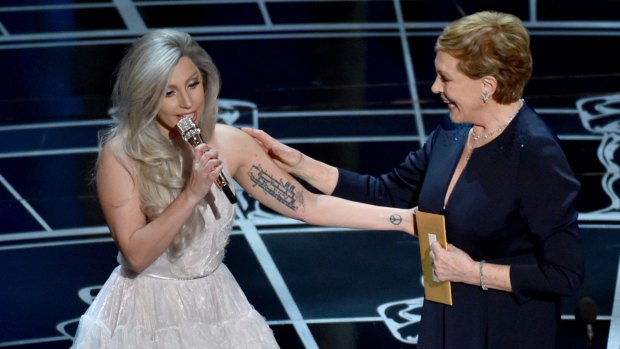 Favourite things: Lady Gaga, left, and Julie Andrews speak at the Oscars.