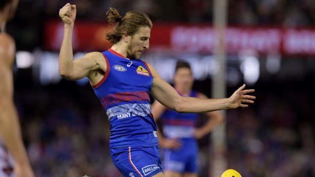 Marcus Bontempelli kicks a crucial late goal against the Bombers, one of the Bulldogs' best wins of the season. 