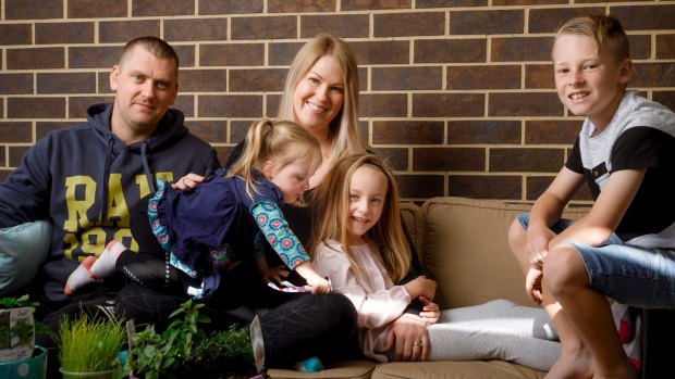 Erica Mitchell and her family are considering moving out of Canberra to a regional town as they struggle to cost with rising living expenses. L-R: Josh and Erica Mitchell with their children Sofia, 2, Aria, 6, and Phoenix, 9.