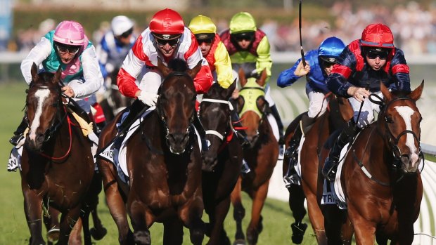 Fighting finish: Mongolian Khan (left) wins the Caulfield Cup from Trip To Paris. 