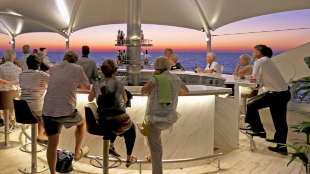 Sunset drinks on the deck of Coral Discoverer.