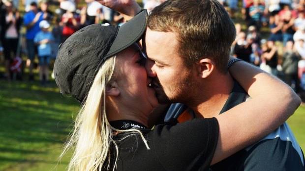 Love match:  Andreas Harto  proposes to his girfriend Louise De Fries on the 16th green.