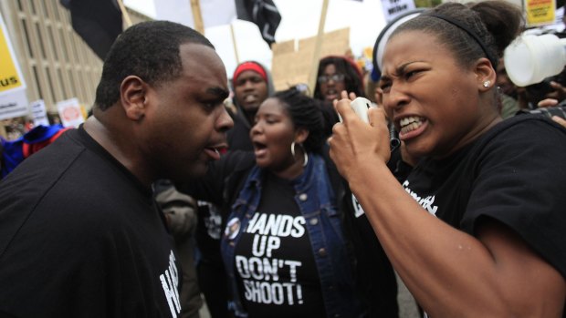 Demonstrators protest the shooting of Michael Brown in St Louis on Saturday.