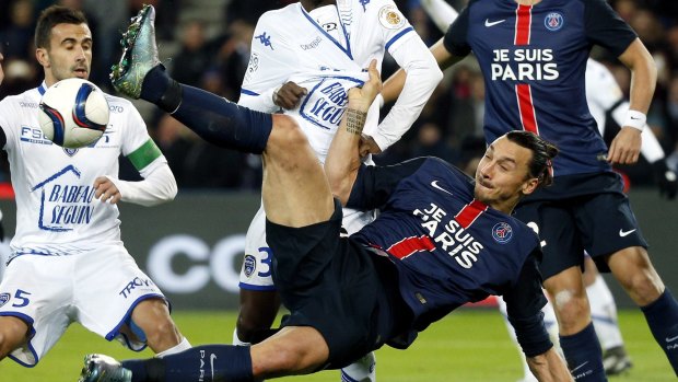Emotional win: PSG's Zlatan Ibrahimovic wearing a jersey reading: "I am Paris" in memory of the victims of the Paris attacks, kicks the ball during the French League One clash between Paris Saint Germain and Troyes.