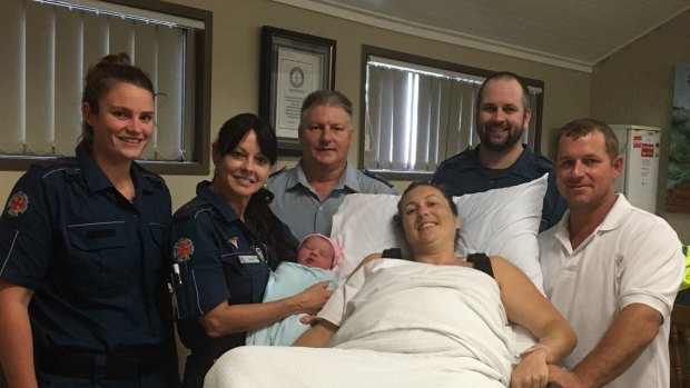 Baby Billianna with paramedia Pamela Price, mother Suzanne, dad Tim, and the Whitsunday Ambulance crew.