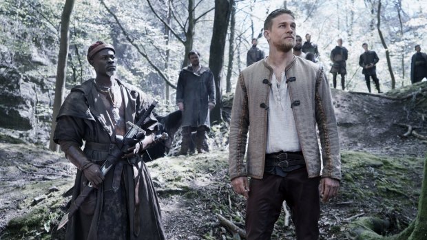 Charlie Hunnam as king-to-be Arthur (right) with Neil Maskell as Back Lack in <i>King Arthur: Legend of the Sword</i>.