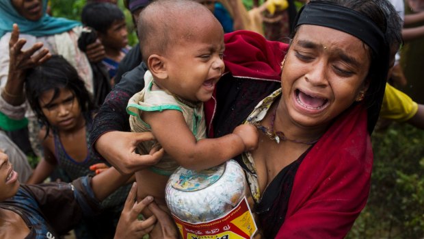 A Rohingya woman after a fight erupted during food distribution at a refugee camp in Kutupalong, Bangladesh