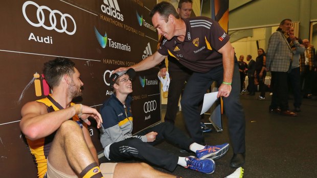 Jack Gunston and Hawks coach Alastair Clarkson have a word in the rooms after the game. 