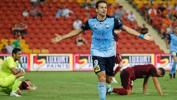 Clinical: Bobo leaves Brisbane players sprawling after finishing off a delightful cross from Milos Ninkovic.