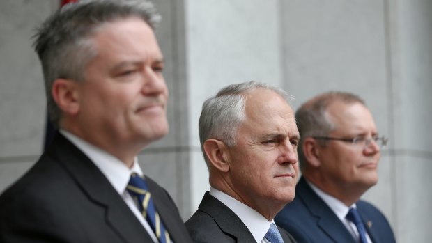 Minister for Finance Mathias Cormann, Prime Minister Malcolm Turnbull and Treasurer Scott Morrison announce the compromise on Tuesday.