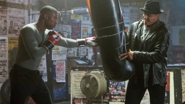 Michael B Jordan (left) is the champion boxer Adonis Creed and Sylvester Stallone is Rocky Balboa in Creed II.