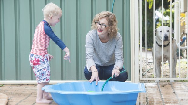 Peta Ryder of Southgate and her son Hugh enjoy the winter sun in Grafton on Saturday. 