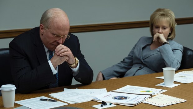 Christian Bale as Dick Cheney, left, and Amy Adams as Lynne Cheney in "Vice". 
