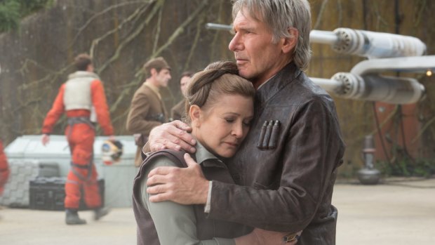 Wearing well ... Harrison Ford in THAT jacket comforts Leia (Carrie Fisher) in Star Wars: The Force Awakens.
