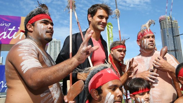 Roger Federer with representatives of the indigenous Mirrabooka tribe after a traditional Welcome to Country ceremony ahead of the Brisbane International on Saturday.