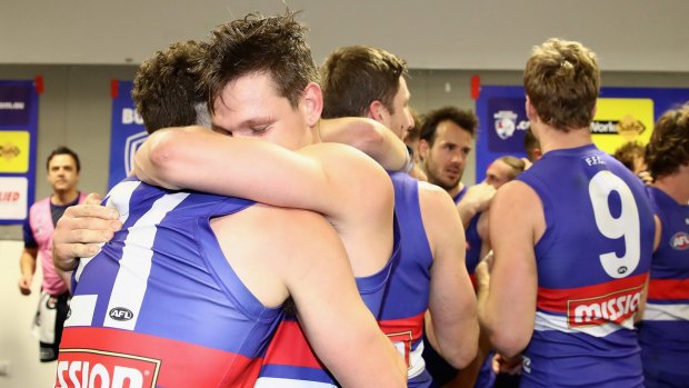 Bulldogs Tom Liberatore and Clay Smith embrace after their impressive win over the Swans.