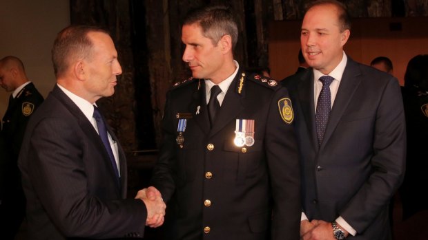 Immigration Minister Peter Dutton, with Prime Minister Tony Abbott at the swearing in ceremony of inaugural Border Force Commissioner Roman Quaedvlieg in July.