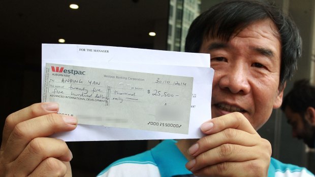 Cleaner Anping Yan leaving court with the cancelled cheque during the trial. 