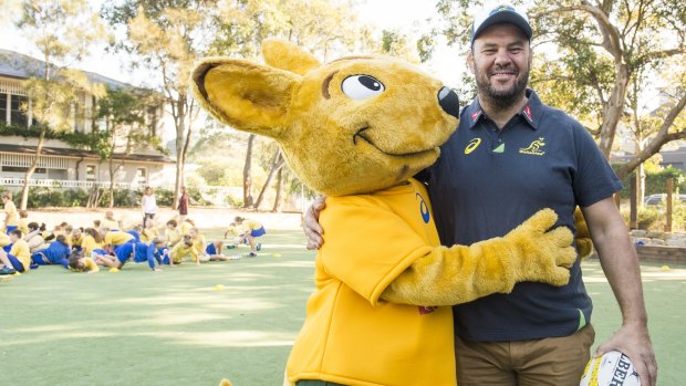 Hey, Cheik, can I have a run?: Wallabies coach Michael Cheika with one of the unlucky few left out of his squad for the England series.
