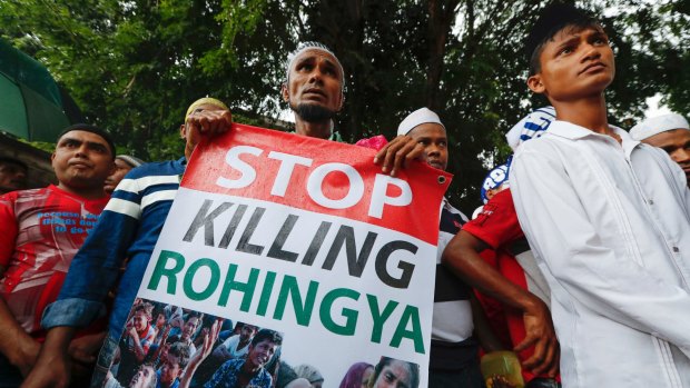 A Rohingya holds a banner during protest after Friday prayers outside the Myanmar embassy in Kuala Lumpur, Malaysia,  in November.