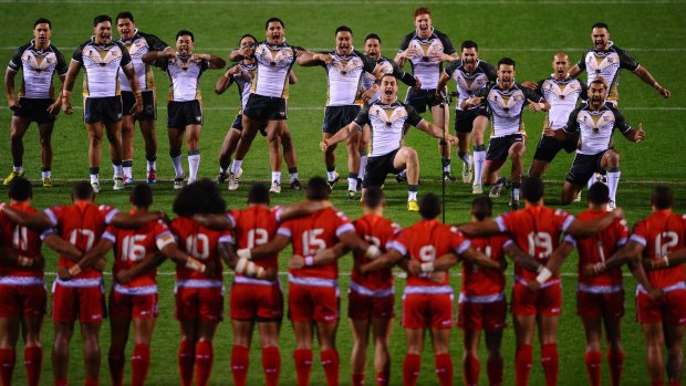 Development of minnows critical: The Cook Islands perform a haka in front of the Tonga team prior to the Rugby League World Cup match at Leigh in 2013.