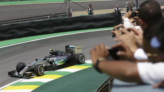 In focus: Spectators take pictures of Mercedes driver Nico Rosberg during practice for the Formula One Brazilian Grand Prix at the Interlagos race track in Sao Paulo.