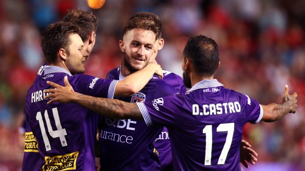 Too easy: Diego Castro celebrates with Adam Taggart, centre, and other Glory players.