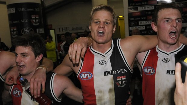 After an epic encounter against Geelong in 2009, St Kilda's Andrew McQualter, Nick Riewoldt, and Brendon Goddard sing the club song.

