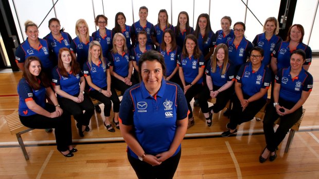 North Melbourne women’s football operations manager Laura Kane with other female staff who work at the club.