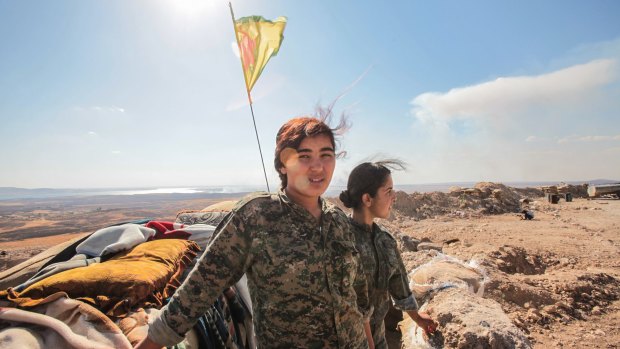 Women fighters from the Kurdish YPG militia. Turkey's concerns about Kurdish military strength have hindered the formation of a coalition to check Islamic State.