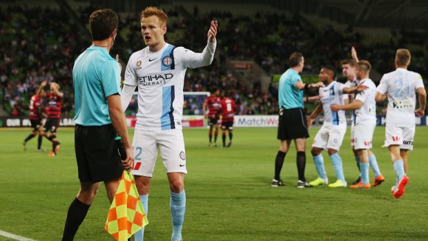 Frustration: Melbourne City's Jack Clisby argues with the assistant referee after the Wanderers' contentious second goal.