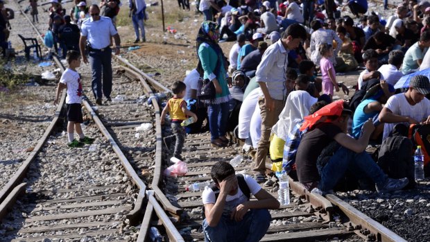 Migrants cross the Greece-Macedonia border. Immigrants are entering Europe at a rate of about 3000 a day, and the EU doesn't know what do about it. 