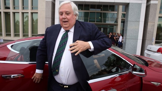 Clive Palmer arrived at Parliament House on Thursday in a Tesla electric car.