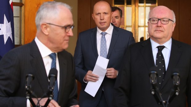 George Brandis with Peter Dutton, centre, and Malcolm Turnbull  announcing the new Home Affairs ministry in July.