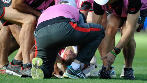 Nick Riewoldt is attended to by medical staff after he was injured during the game against the Adelaide Crows on Saturday. 