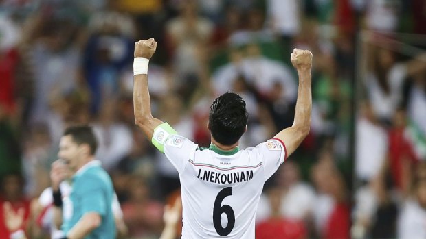 Javad Nekounam celebrates Iran's Asian Cup group stage win over Bahrain.