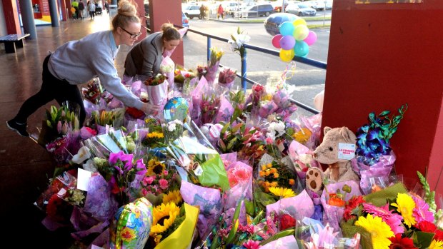 People leave tributes to Andrea Lehane at Carrum Downs shopping centre, where she was struck by a motorcyclist on Wednesday. 