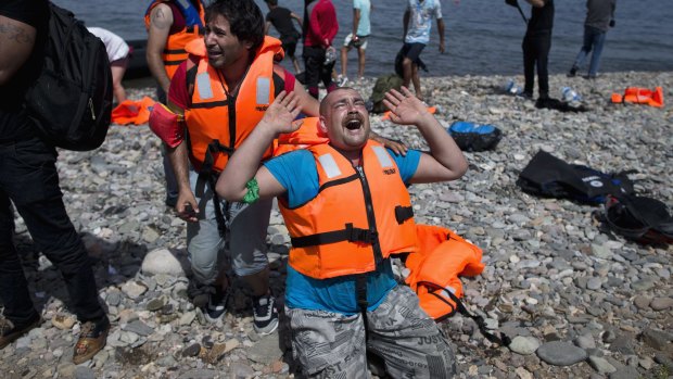 Perilous journey: Syrian refugees arrive on Lesbos after crossing from Turkey last week.