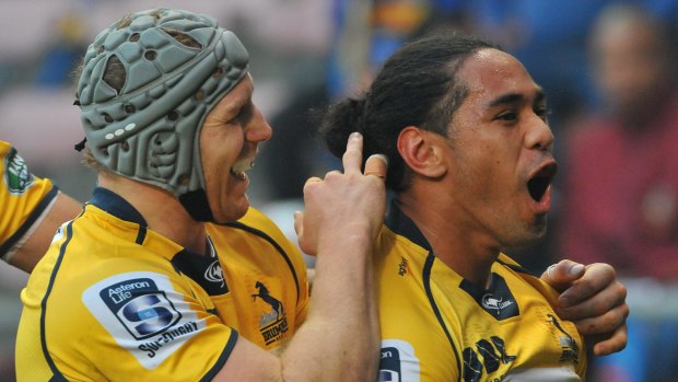 Joe Tomane of the Brumbies celebrates scoring the opening try.