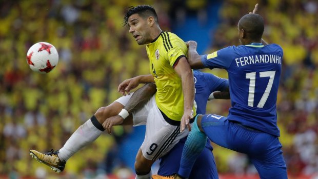 Colombia's Radamel Falcao Garcia (left) battles for the ball with Brazil's Fernandinho. Photo: AP