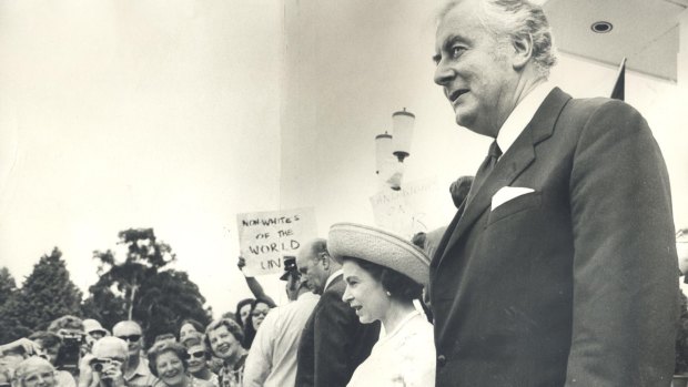 The Queen and Prime Minister Gough Whitlam walk down the steps of the Parliament House in 1973. 