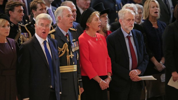 The leader of Britain's opposition Labour party Jeremy Corbyn, right, stands for the national anthem during  the 75th anniversary Battle of Britain memorial service at St Paul's Cathedral in London on Tuesday, but doesn't sing. 