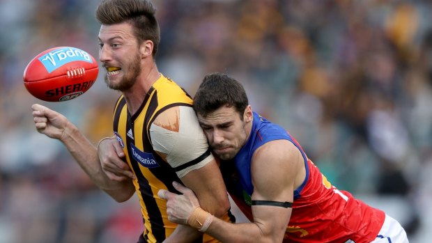 Hawthorn's Jack Fitzpatrick is tackled by Michael Close.