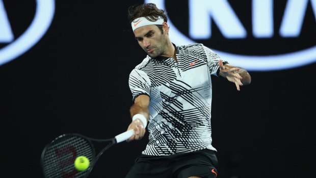 Roger Federer plays a forehand in his first round match against Jurgen Melzer.