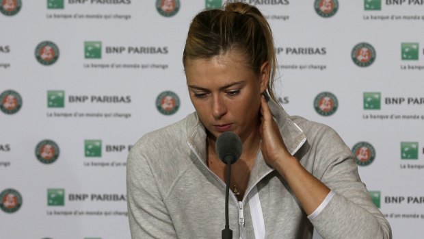 A downcast Maria Sharapova speaks to the media after being ousted in the fourth round.