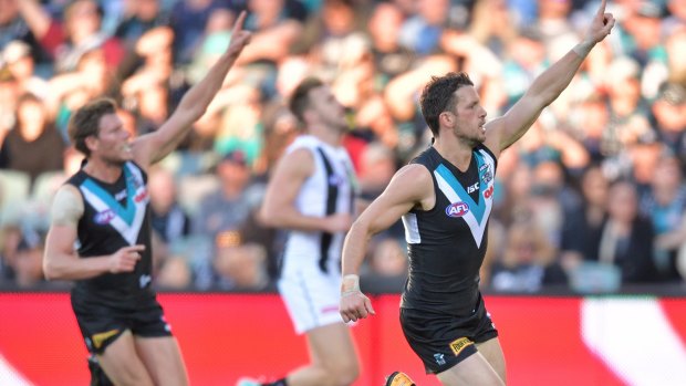 Point of interest: Port Adelaide players seek supply.