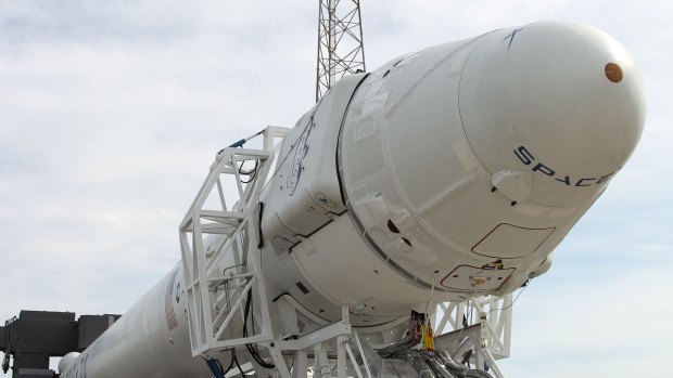 Revolutionary ... the Dragon spacecraft and its reusable Falcon 9 rocket, both made by SpaceX, are rolled to the launch pad ahead of a static firing test for the rocket. 