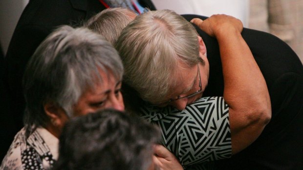 Kevin Rudd hugs guests after his apology to Indigenous Australians in 2008.
