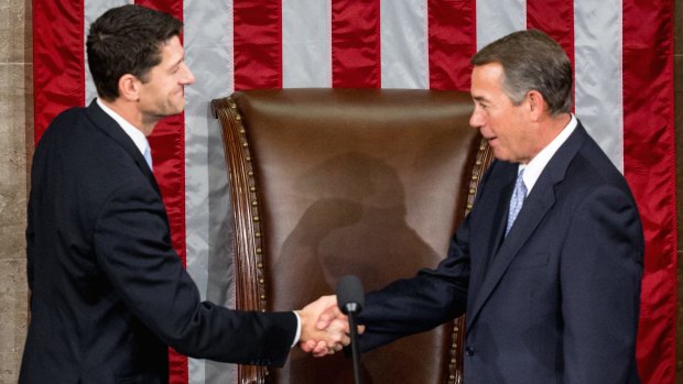 Outgoing House Speaker John Boehner greets his successor.